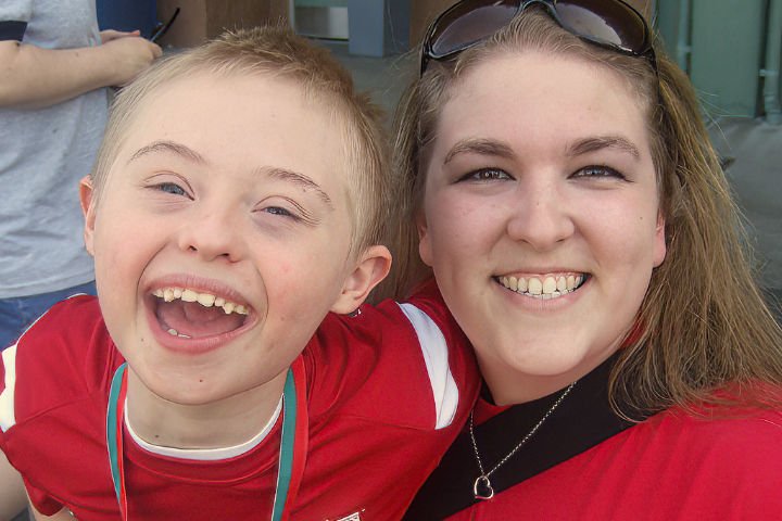 Smiling child and caregiver